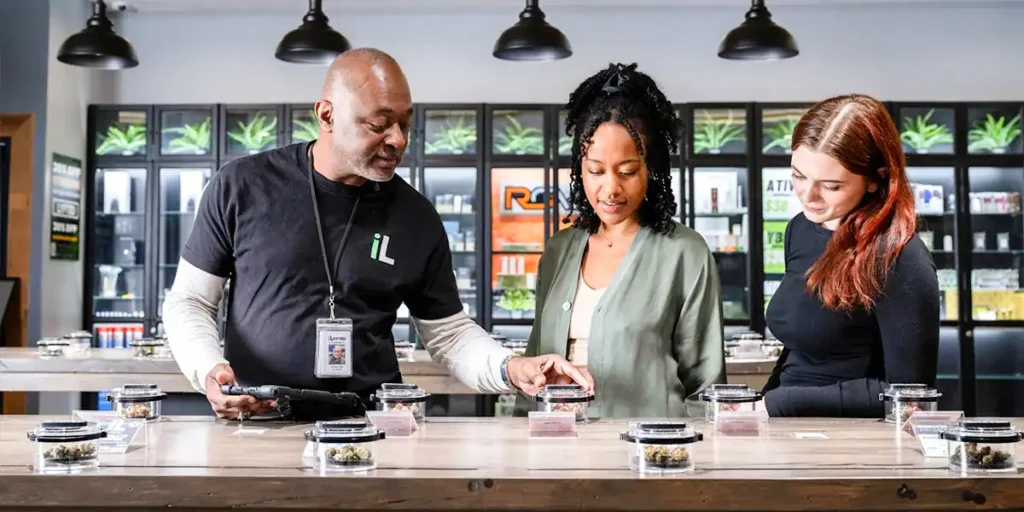 Cannabis dispensary employees discussing retail career opportunities