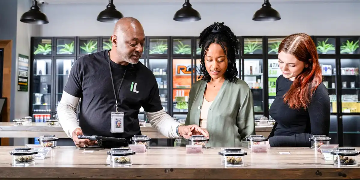 Cannabis dispensary employees discussing retail career opportunities